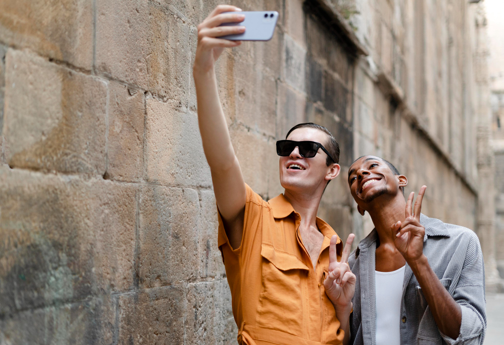 A travel influencer taking a selfie with a scenic mountain backdrop while holding a smartphone with Instagram open.